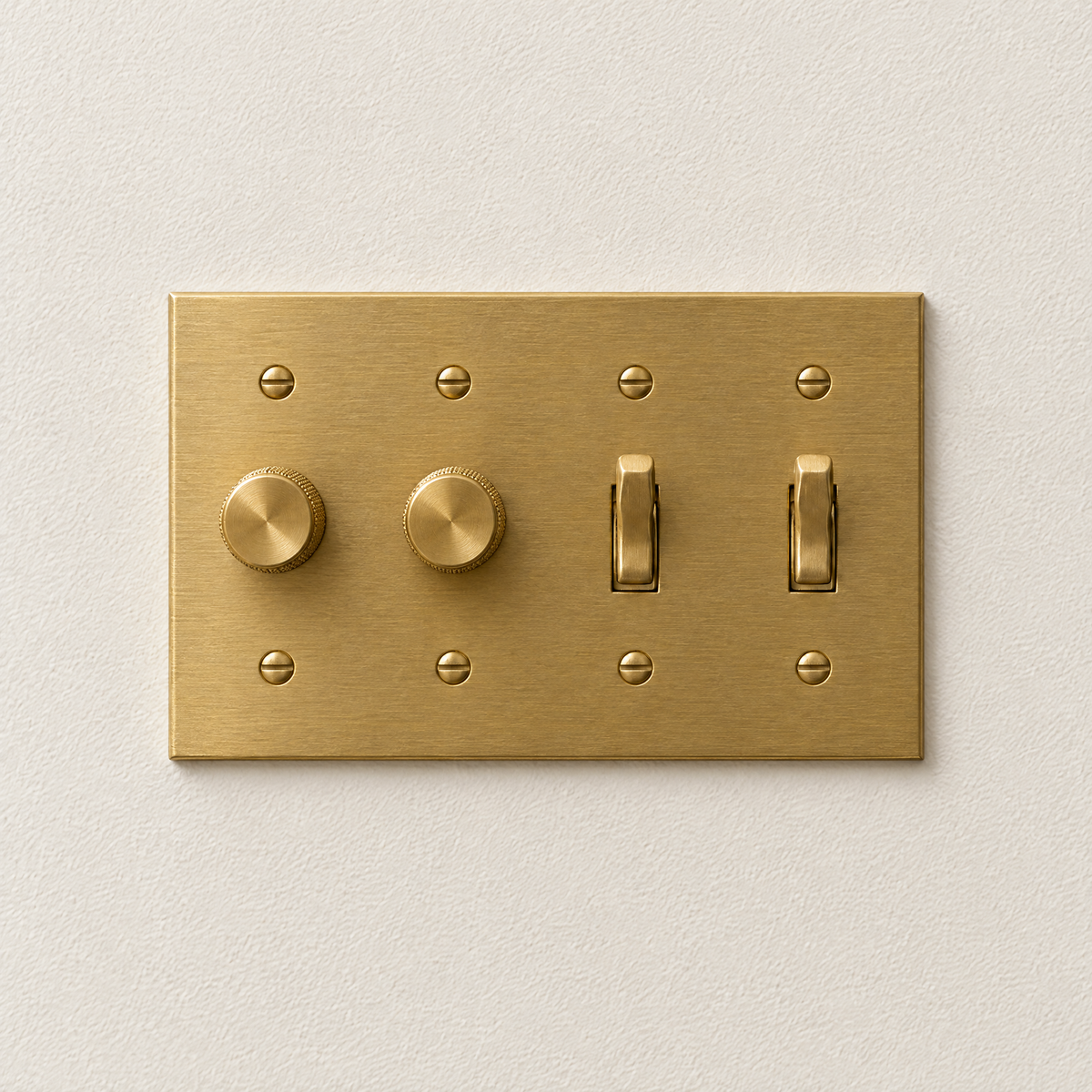 4-gang solid brass plate with two rotary dimmers and two toggles, unlacquered brass